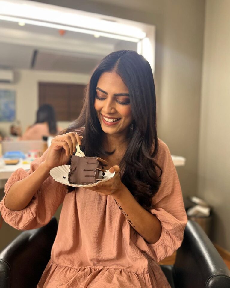 Malavika Mohanan Eating A Delicious Cake Presented By Her Co-Star
