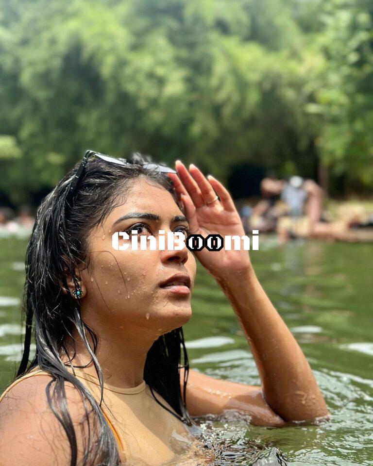Actress Raksha Cherin Enjoys Bathing Under A Waterfall