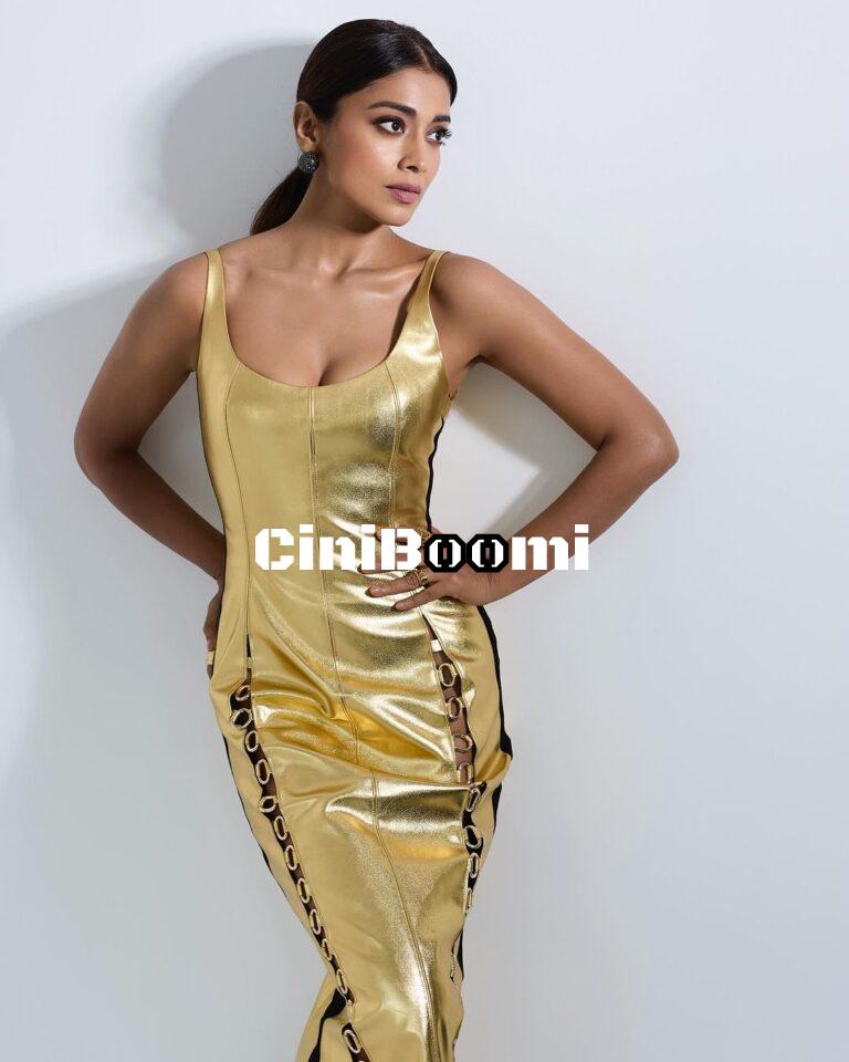 Actress Shriya Saran Shines Radiantly In Gold Outfit