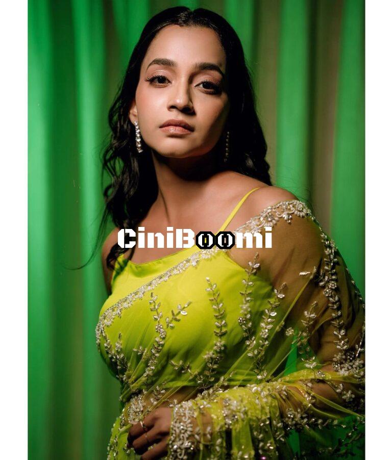 Actress Abarnathi Sizzles In Neon Green Saree